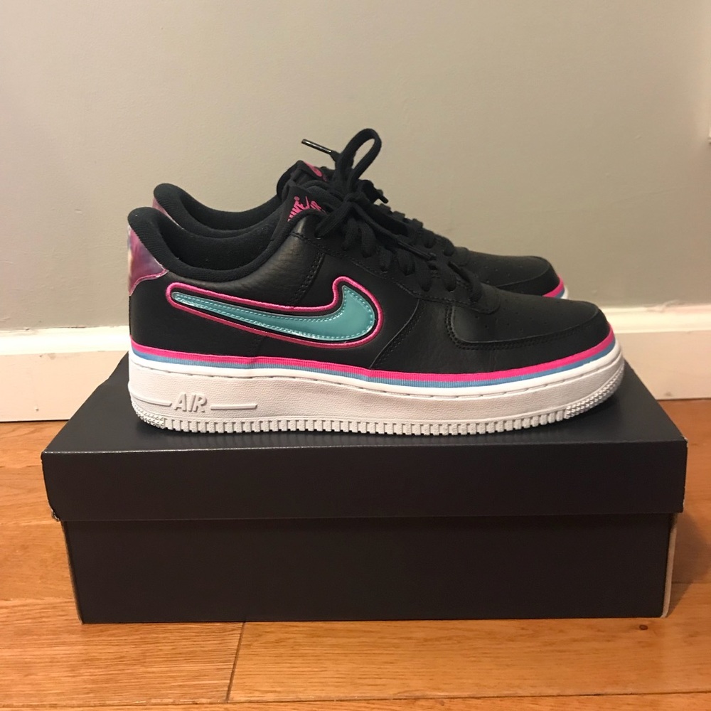 Nike Women's Black Sneakers with Teal and Pink Accents